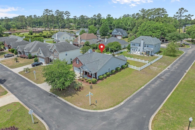 aerial view of residential area with a tree filled landscape