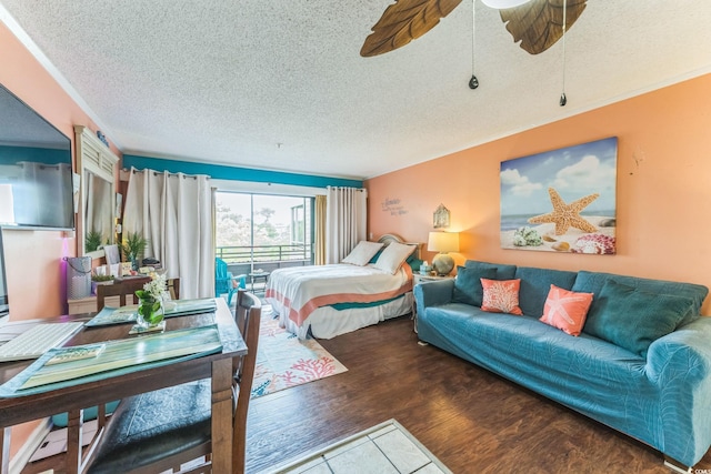415 Ocean Creek Dr Unit 2330, Myrtle Beach, SC 29572 - bedroom featuring a textured ceiling, wood finished floors, and ceiling fan