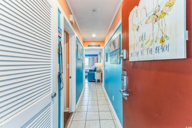 415 Ocean Creek Dr Unit 2330, Myrtle Beach, SC 29572 - hallway with light tile patterned flooring, a textured ceiling, and baseboards