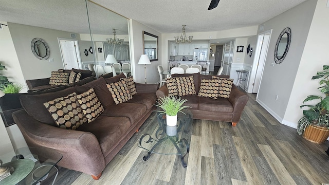 102 N Ocean Blvd Unit 405, North Myrtle Beach, SC 29582 - living area featuring wood finished floors, a chandelier, a textured ceiling, ceiling fan, and baseboards