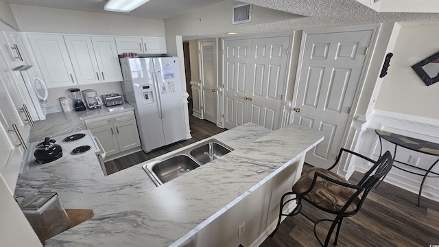 102 N Ocean Blvd Unit 405, North Myrtle Beach, SC 29582 - kitchen featuring white appliances, a sink, white cabinetry, and dark wood-style flooring