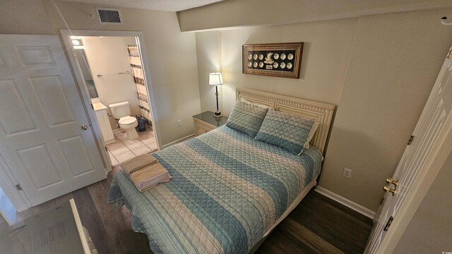 102 N Ocean Blvd Unit 405, North Myrtle Beach, SC 29582 - bedroom with wood finished floors and baseboards