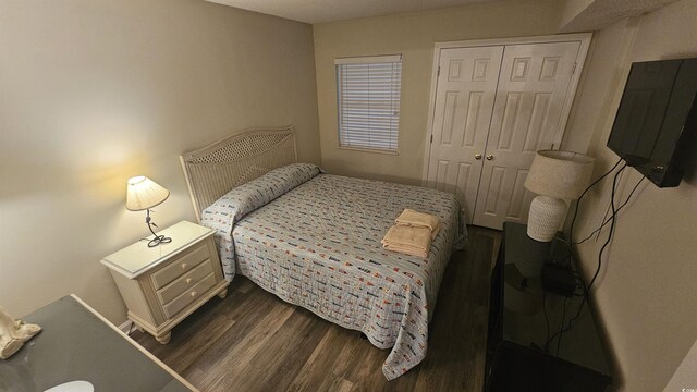 102 N Ocean Blvd Unit 405, North Myrtle Beach, SC 29582 - bedroom featuring dark wood-style floors and a closet