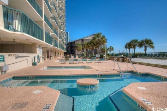 102 N Ocean Blvd Unit 405, North Myrtle Beach, SC 29582 - community pool featuring a community hot tub and a patio area