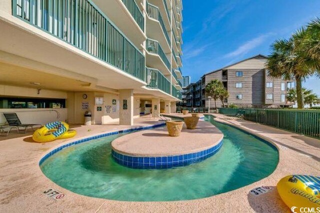 102 N Ocean Blvd Unit 405, North Myrtle Beach, SC 29582 - community pool featuring a patio