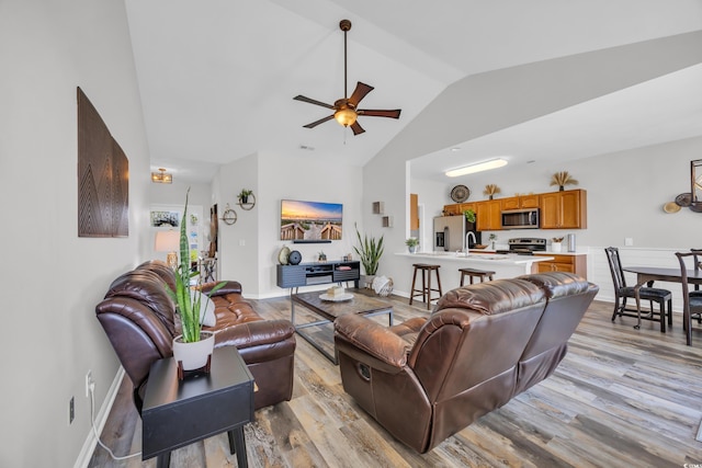1451 Virginia Pine Dr, Longs, SC 29568 - living room with light wood-style floors, ceiling fan, baseboards, and high vaulted ceiling