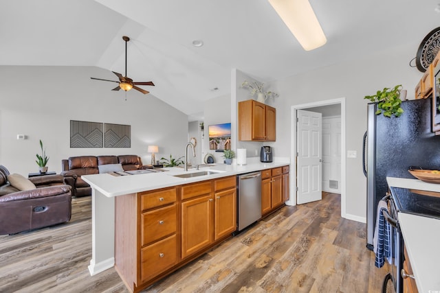 1451 Virginia Pine Dr, Longs, SC 29568 - kitchen featuring a sink, appliances with stainless steel finishes, open floor plan, vaulted ceiling, and a ceiling fan