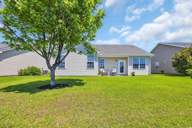 1451 Virginia Pine Dr, Longs, SC 29568 - back of property featuring a yard, central AC, a patio area, and a shingled roof