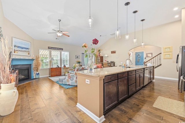 605 Ginger Lily Way, Little River, SC 29566 - kitchen with vaulted ceiling, dark wood-type flooring, a ceiling fan, open floor plan, and dark brown cabinetry