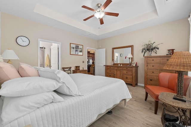 605 Ginger Lily Way, Little River, SC 29566 - bedroom with a raised ceiling, light wood finished floors, a ceiling fan, baseboards, and stainless steel fridge