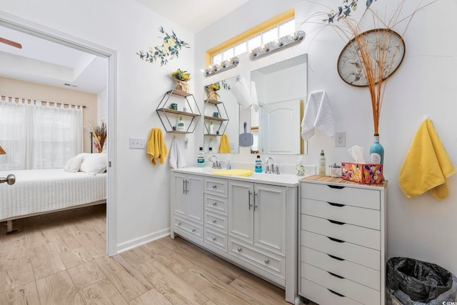 605 Ginger Lily Way, Little River, SC 29566 - full bathroom with double vanity, baseboards, connected bathroom, and wood finished floors