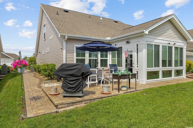 605 Ginger Lily Way, Little River, SC 29566 - back of property with roof with shingles, a patio area, a yard, and central AC unit