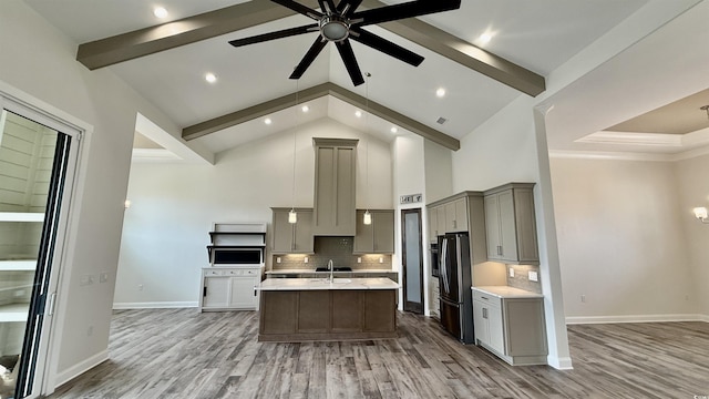 kitchen featuring gray cabinets, freestanding refrigerator, high vaulted ceiling, a ceiling fan, and beam ceiling