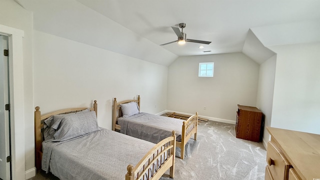 carpeted bedroom featuring vaulted ceiling, baseboards, and a ceiling fan