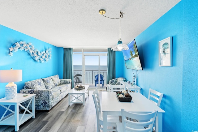 2801 S Ocean Blvd Unit 1634, North Myrtle Beach, SC 29582 - dining space featuring a textured ceiling, wood finished floors, and a textured wall