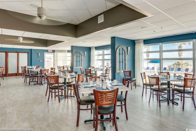 2801 S Ocean Blvd Unit 1634, North Myrtle Beach, SC 29582 - dining area with a paneled ceiling, ceiling fan, and wood finished floors