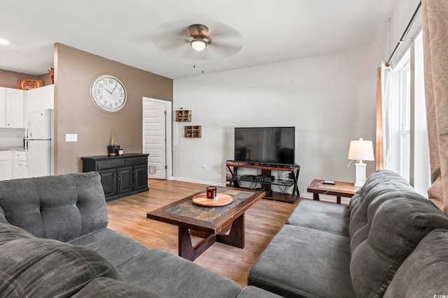 751 Dusty Pine Way, Myrtle Beach, SC 29588 - living room featuring a ceiling fan, light wood-type flooring, and baseboards