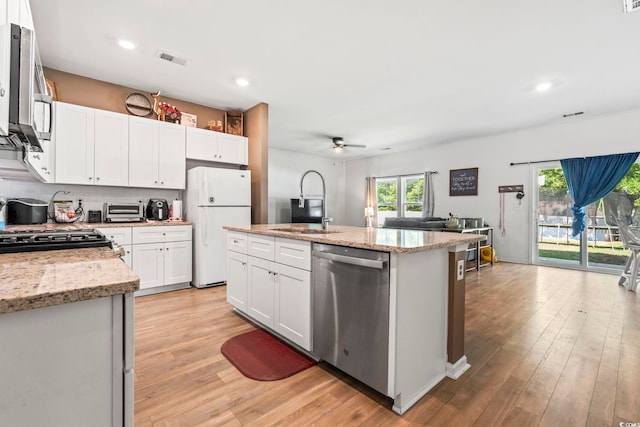 751 Dusty Pine Way, Myrtle Beach, SC 29588 - kitchen featuring appliances with stainless steel finishes, ceiling fan, a sink, light wood-style flooring, and white cabinetry