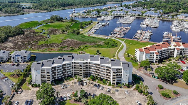 4440 Nassau Ct Unit 308, Little River, SC 29566 - drone / aerial view of a nearby body of water, apartment complex / building, and numerous boat docks