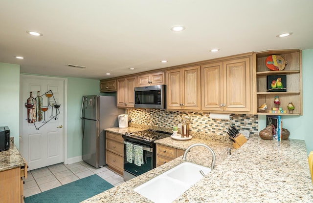 4440 Nassau Ct Unit 308, Little River, SC 29566 - kitchen with appliances with stainless steel finishes, a sink, light stone counters, decorative backsplash, and recessed lighting