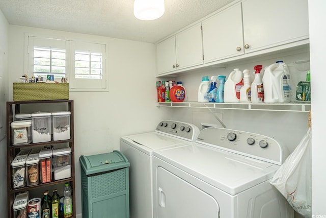 4440 Nassau Ct Unit 308, Little River, SC 29566 - laundry area with washing machine and clothes dryer, a textured ceiling, and cabinet space