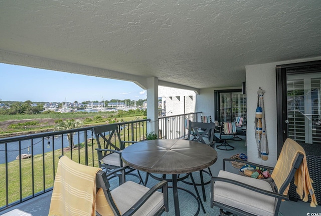 4440 Nassau Ct Unit 308, Little River, SC 29566 - balcony with outdoor dining space and a water view
