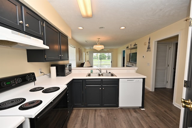 669 Tupelo Ln Unit 18D, Longs, SC 29568 - kitchen with electric range oven, white dishwasher, black microwave, under cabinet range hood, and a peninsula