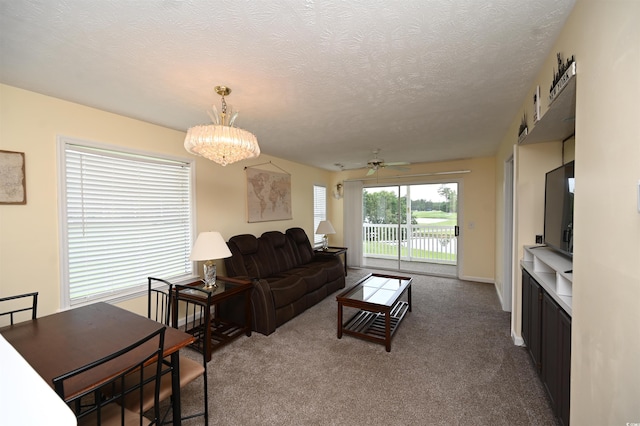 669 Tupelo Ln Unit 18D, Longs, SC 29568 - living room with dark colored carpet, a chandelier, ceiling fan, and a textured ceiling