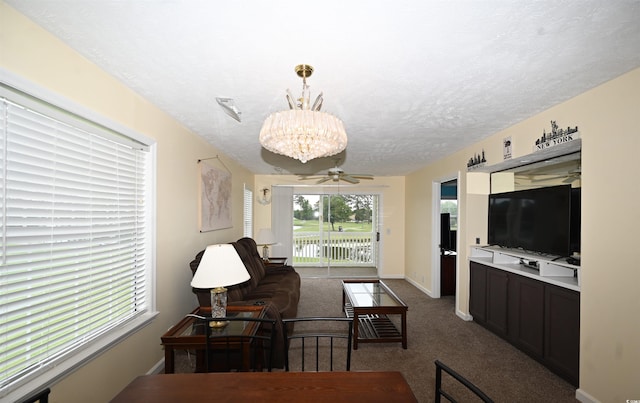 669 Tupelo Ln Unit 18D, Longs, SC 29568 - carpeted living area with a chandelier and a textured ceiling