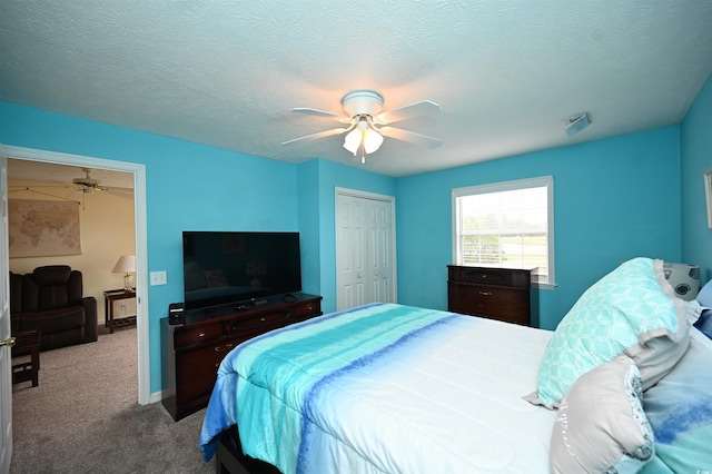 669 Tupelo Ln Unit 18D, Longs, SC 29568 - carpeted bedroom with a ceiling fan, a closet, and a textured ceiling