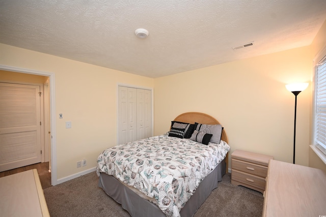 669 Tupelo Ln Unit 18D, Longs, SC 29568 - carpeted bedroom with a closet and a textured ceiling