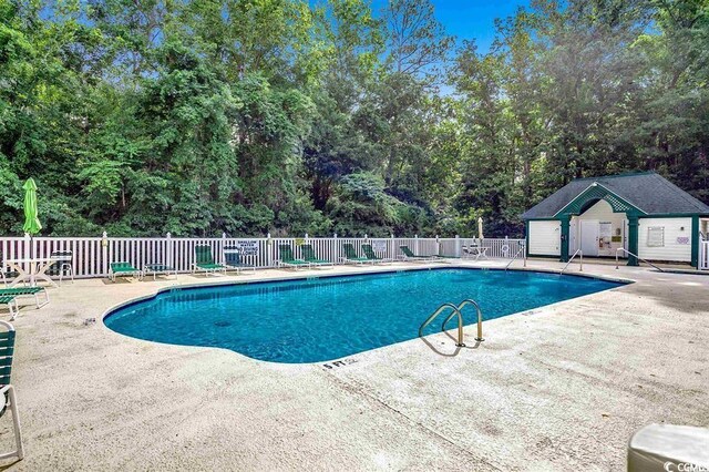 669 Tupelo Ln Unit 18D, Longs, SC 29568 - community pool featuring a patio