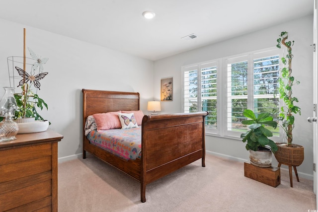 205 Marsh Deer Pl, Surfside Beach, SC 29575 - bedroom featuring multiple windows, light colored carpet, and baseboards