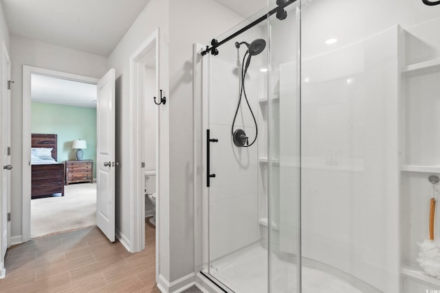 205 Marsh Deer Pl, Surfside Beach, SC 29575 - full bath with a shower stall, connected bathroom, toilet, wood finished floors, and baseboards