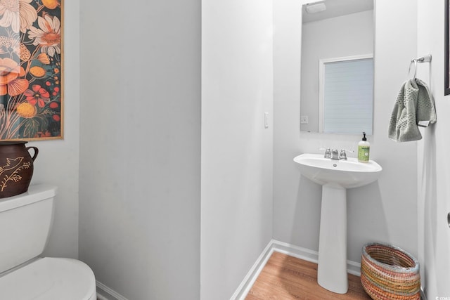 205 Marsh Deer Pl, Surfside Beach, SC 29575 - half bath featuring toilet, wood finished floors, baseboards, and a sink