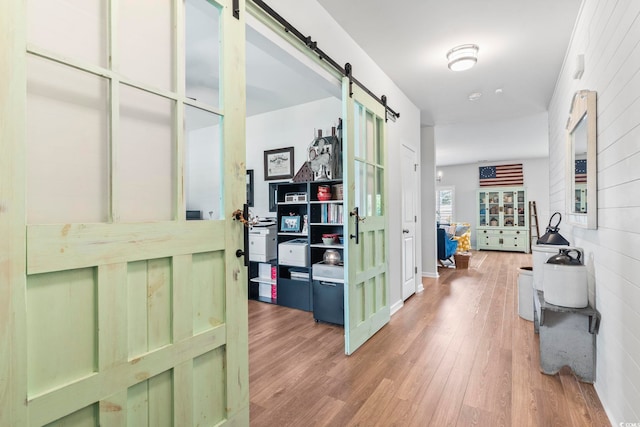 205 Marsh Deer Pl, Surfside Beach, SC 29575 - hallway with a barn door and wood finished floors