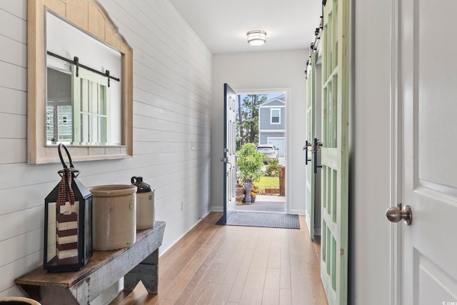 205 Marsh Deer Pl, Surfside Beach, SC 29575 - foyer entrance with a barn door, wood-type flooring, and wooden walls