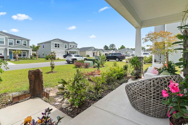 205 Marsh Deer Pl, Surfside Beach, SC 29575 - covered porch featuring a residential view and a lawn