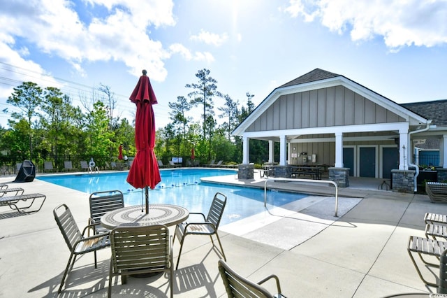 1141 Prescott Cir, Myrtle Beach, SC 29577 - community pool featuring a patio area and an outdoor structure
