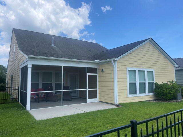1141 Prescott Cir, Myrtle Beach, SC 29577 - rear view of property featuring a sunroom, a patio area, and a shingled roof