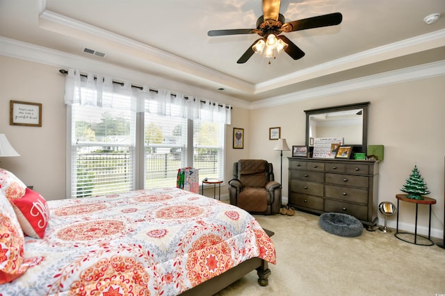 1141 Prescott Cir, Myrtle Beach, SC 29577 - bedroom with a tray ceiling, crown molding, carpet flooring, and a ceiling fan