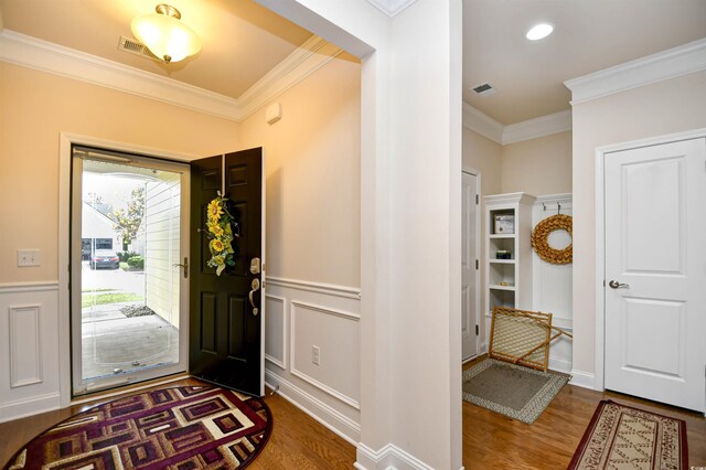1141 Prescott Cir, Myrtle Beach, SC 29577 - entrance foyer with wood finished floors, crown molding, and wainscoting