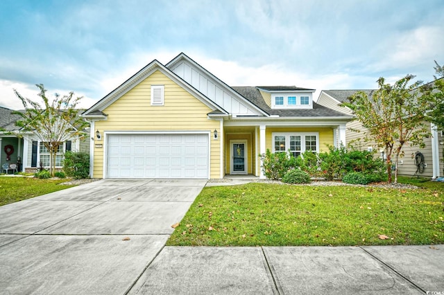 1141 Prescott Cir, Myrtle Beach, SC 29577 - view of front of house with a garage, concrete driveway, board and batten siding, and a front yard