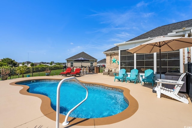 view of pool with a patio area and a fenced backyard