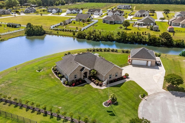aerial view of residential area with a large body of water