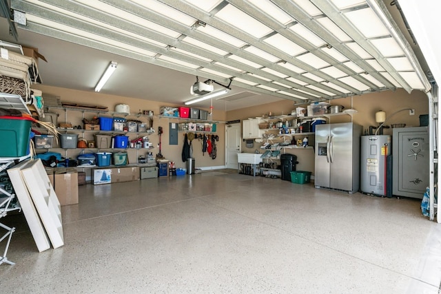 garage featuring stainless steel refrigerator with ice dispenser, electric water heater, and a garage door opener