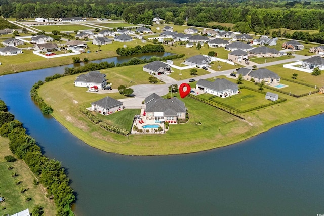 aerial view of residential area with a large body of water