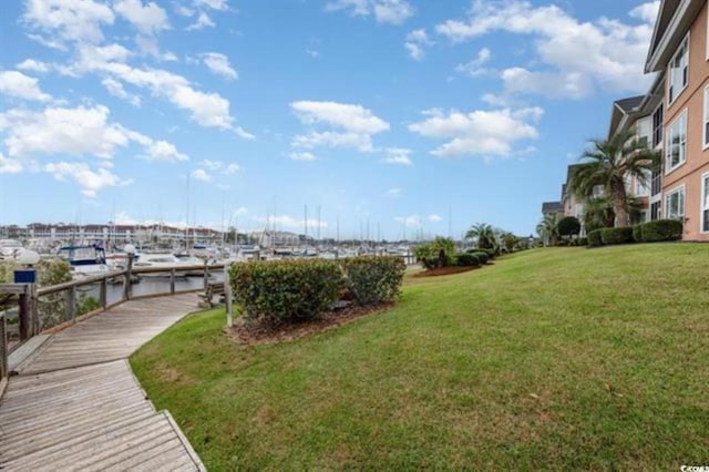 4633 Lightkeepers Way Unit 5-F, Little River, SC 29566 - view of green lawn featuring a boat dock