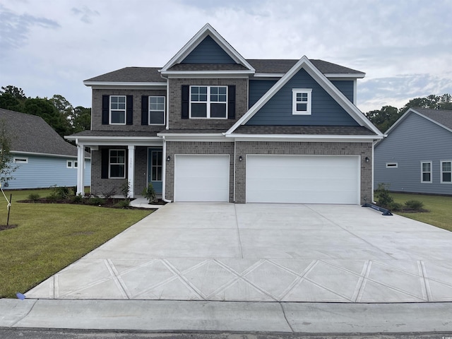 3391 Moss Bridge Ln, Myrtle Beach, SC 29579 - craftsman house with brick siding, a garage, a front yard, driveway, and roof with shingles