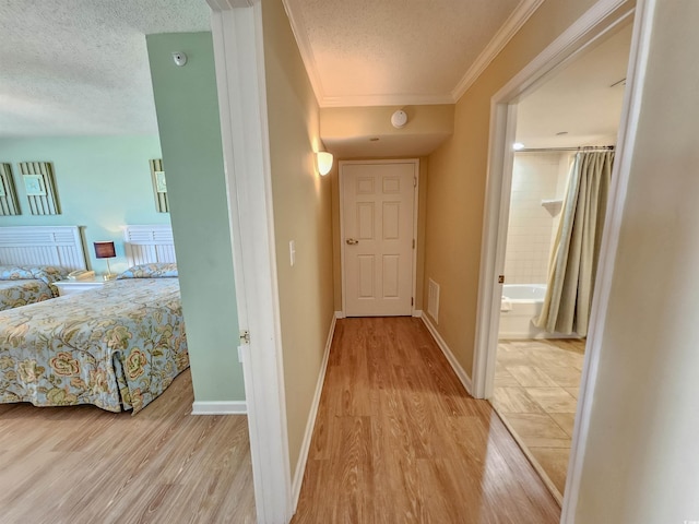 8560 Queensway Blvd Unit 508, Myrtle Beach, SC 29572 - hallway with a textured ceiling, wood finished floors, and ornamental molding